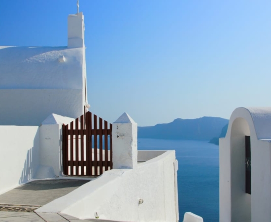 Santorini Island, houses and the Kameni island Santorini Island, houses and the Kameni island