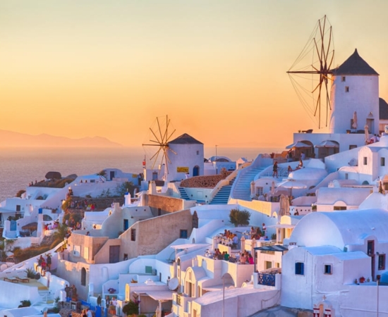 Windmills at Santorini Island at sunset Windmills at Santorini Island at sunset