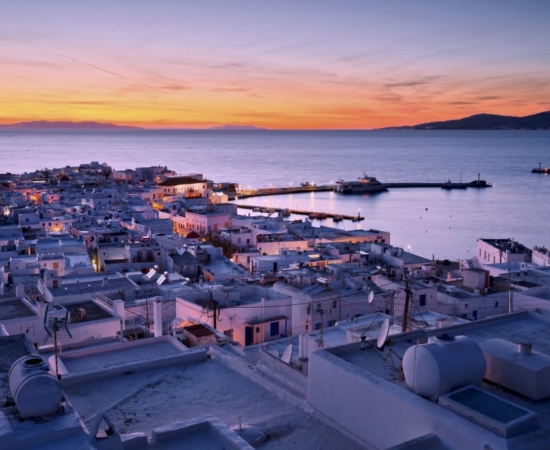 Tinos island port at dawn. Tinos island port at dawn.