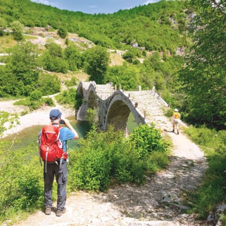 Three arches bridge made of rocks in Zagorochoria, Greece.
